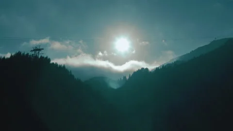 Beautiful sunset in the mountains. the rays of the sun shine between the clouds Stock Footage 169018436