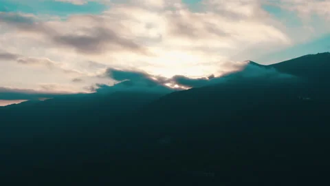 Beautiful sunset in the mountains. the rays of the sun shine between the clouds Stock Footage 169018546