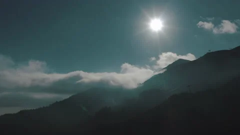 Beautiful sunset in the mountains. the rays of the sun shine between the clouds Stock Footage 169018656