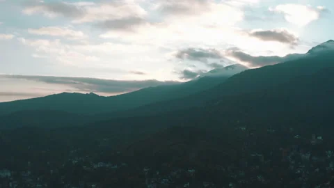 Beautiful sunset in the mountains. the rays of the sun shine between the clouds Stock Footage 169018845