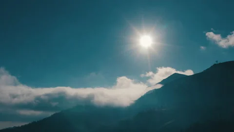 Beautiful sunset in the mountains. the rays of the sun shine between the clouds Stock Footage 169018949