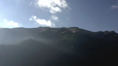 Beautiful sunset in the mountains. the rays of the sun shine between the clouds Stock Footage 169019285