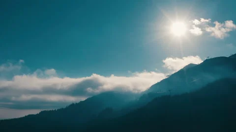 Beautiful sunset in the mountains. the rays of the sun shine between the clouds Stock Footage 169019420