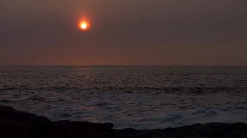 Beautiful sunset by the ocean. Romantic light. Super slow motion 4K Stock Footage 288012928
