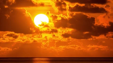 Beautiful sunset in orange sky over ocean water. Timelapse. Stock Footage 275639027