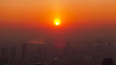 Beautiful sunset over Chao Phraya River. Bangkok city skyscraper silhouettes in Stock Footage 304847501