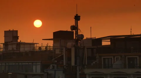 Beautiful sunset over the city Stockbeeldmateriaal 63044657