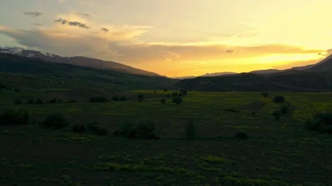 A beautiful sunset over a field of grass Stock Footage 327914323