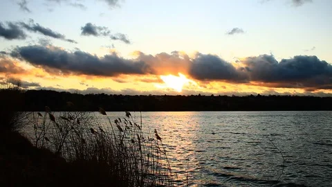 Beautiful sunset over a lake. Stock Footage 129051425