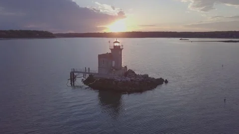 Beautiful Sunset over a Light House Stock Footage 75658874