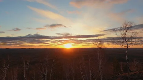 Beautiful sunset over the mountain range. Trees, sky, clouds. Stock Footage 239993446