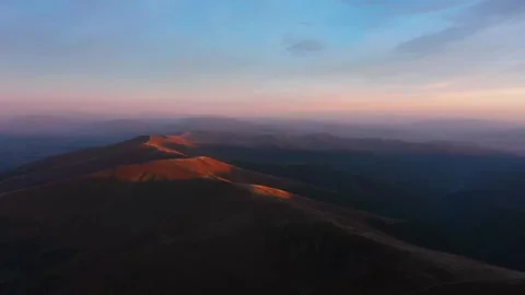 Beautiful sunset over the mountain range at dusk Stock Footage 320293462