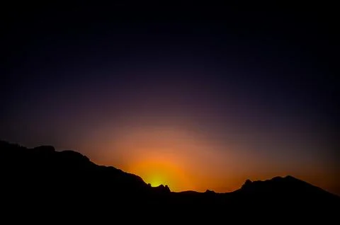 A beautiful sunset over a mountain range Stock Photos