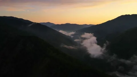 Beautiful sunset over the mountains with clouds Stock Footage 165857112