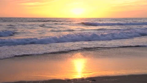 Beautiful sunset over the ocean, calm waves at the beach, California Stock Footage 153977256