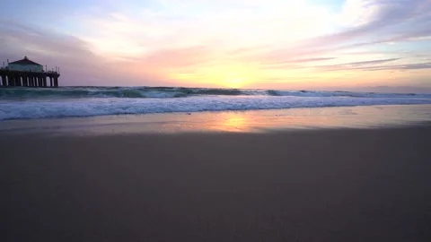 Beautiful sunset over the ocean, calm waves at the beach, California Stock Footage 153977291