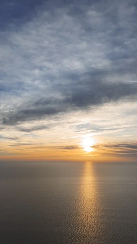Beautiful sunset over the ocean with solar path on the water. Bird's eye view Stock Footage 289104757