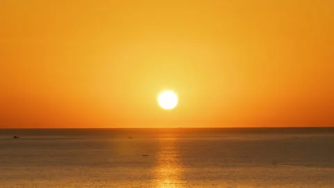 Beautiful Sunset Over The Ocean Time Lapse. The Sun Sets Into The Sea Summer Stock Footage 233966480