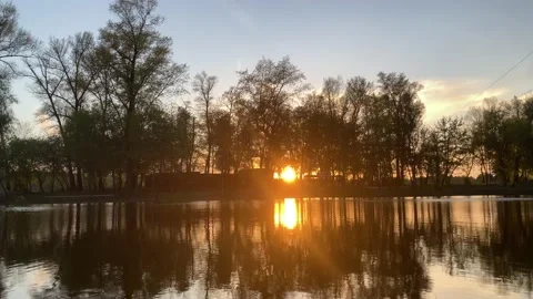 A beautiful sunset over a river with calm water Stock Footage 233760230