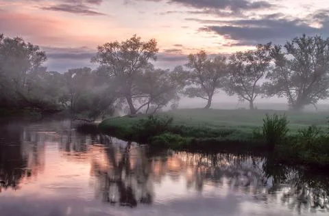 Beautiful sunset over the river with deep fog Foto stock