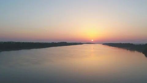 Beautiful sunset over the river in summer, aerial view Stock Footage 117863548