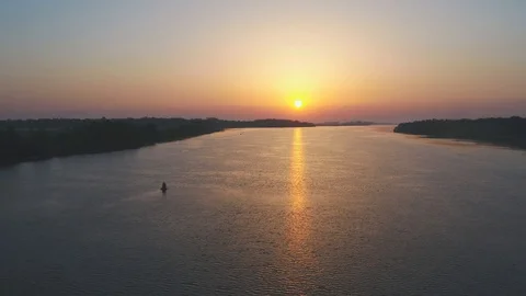 Beautiful sunset over the river in summer, aerial view Stock Footage 117863848