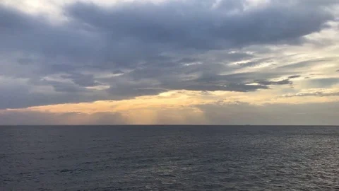 Beautiful sunset over the sea on a cloudy day Stock Footage 83386293