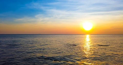 Beautiful sunset over sea with with dramatic sky Stock Footage 104742708