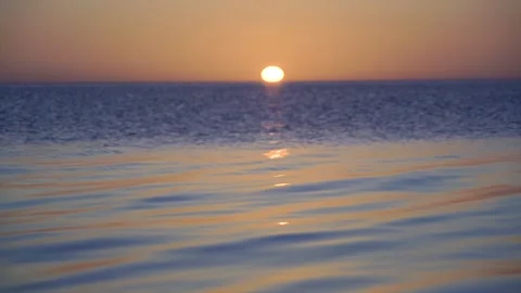 Beautiful sunset over the sea surface Stock Footage 149693359