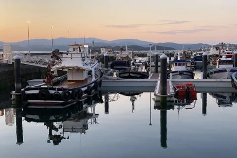 Beautiful sunset over seaport dramatic landscape Stock Photos