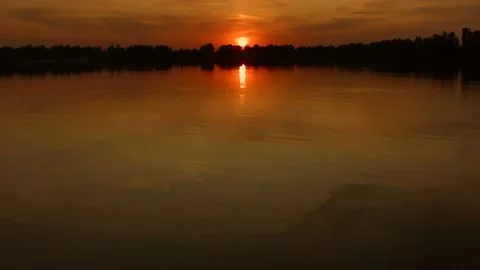 Beautiful sunset over the water surface of the river. Recorded in Raw on Blackma Stock Footage 122049672