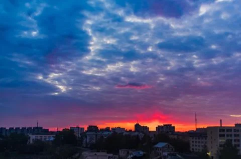 Beautiful sunset reflected in clouds and water Stock Photos