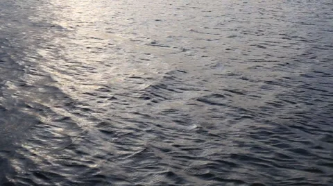 Beautiful sunset reflection sparkles on tiny ripples of sea water Stock Footage 37845351