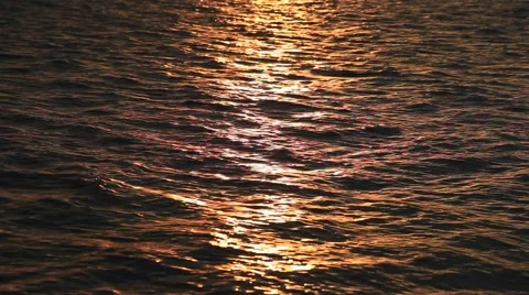 Beautiful sunset reflection sparkles on tiny ripples of sea water Stock Footage 50365828