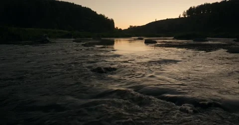 Beautiful sunset reflects on the river Stock Footage 132893774