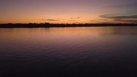 Beautiful sunset on Rio Xingu River in the Amazon Rainforest, Mato Grosso Brazil Stock Footage 150891378