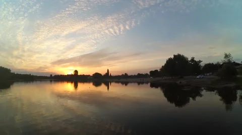 Beautiful Sunset on the River. Blue Sky Reflected in the River, and the Orange Stock Footage 62841901