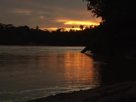 Beautiful Sunset on River Current in Amazon Jungle Rainforest Video stock 112944051