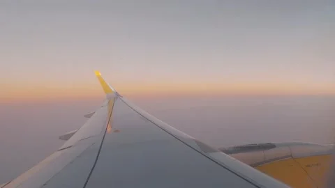 Beautiful sunset scenic view of clouds and sky seen through aircraft window with Stock Footage 171895237