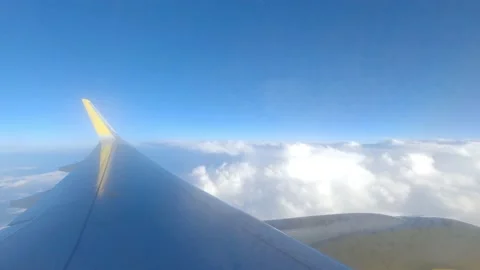 Beautiful sunset scenic view of clouds and sky seen through aircraft window with Stock Footage 171895299