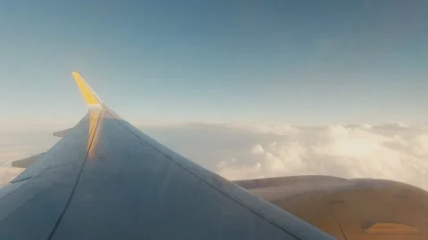 Beautiful sunset scenic view of clouds and sky seen through aircraft window with Stock Footage 171898028