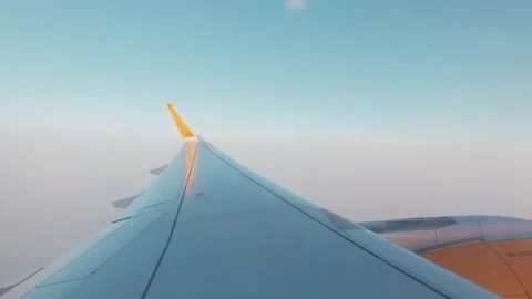 Beautiful sunset scenic view of clouds and sky seen through aircraft window with 库存影片 171898502