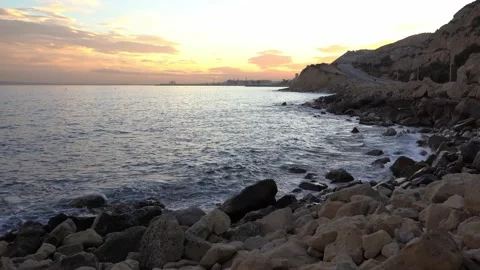 Beautiful sunset in the sea with the movement of the waves on the beach of Ca Stock Footage 153333511