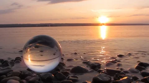 Beautiful Sunset In The Sea With Reflection of The Sun In The Crystal Ball Stock Footage 109147225