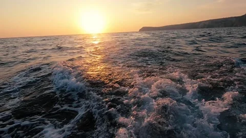 Beautiful sunset sea view from moving boat or yacht slow motion Video stock 161952041