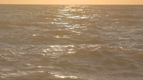 Beautiful sunset with sea waves rolling in Stock Footage 8365840