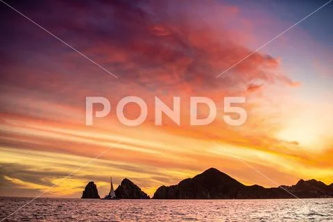 Beautiful Sunset of Seascape with Mountains silhouets. Sea off the Coast of C Stock Photos
