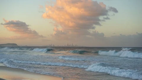 Beautiful sunset seascape with waves and colorfuly lit sky Stock Footage 112973930