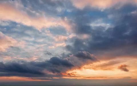 Beautiful sunset sky background with clouds. Stock Photos