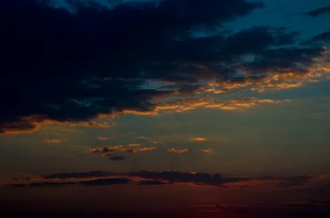 Beautiful sunset sky with clouds. Abstract sky. Stock Photos